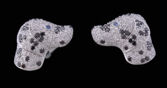 A pair of diamond dog's head cufflinks, designed as Dalmation heads A pair of diamond dog's head