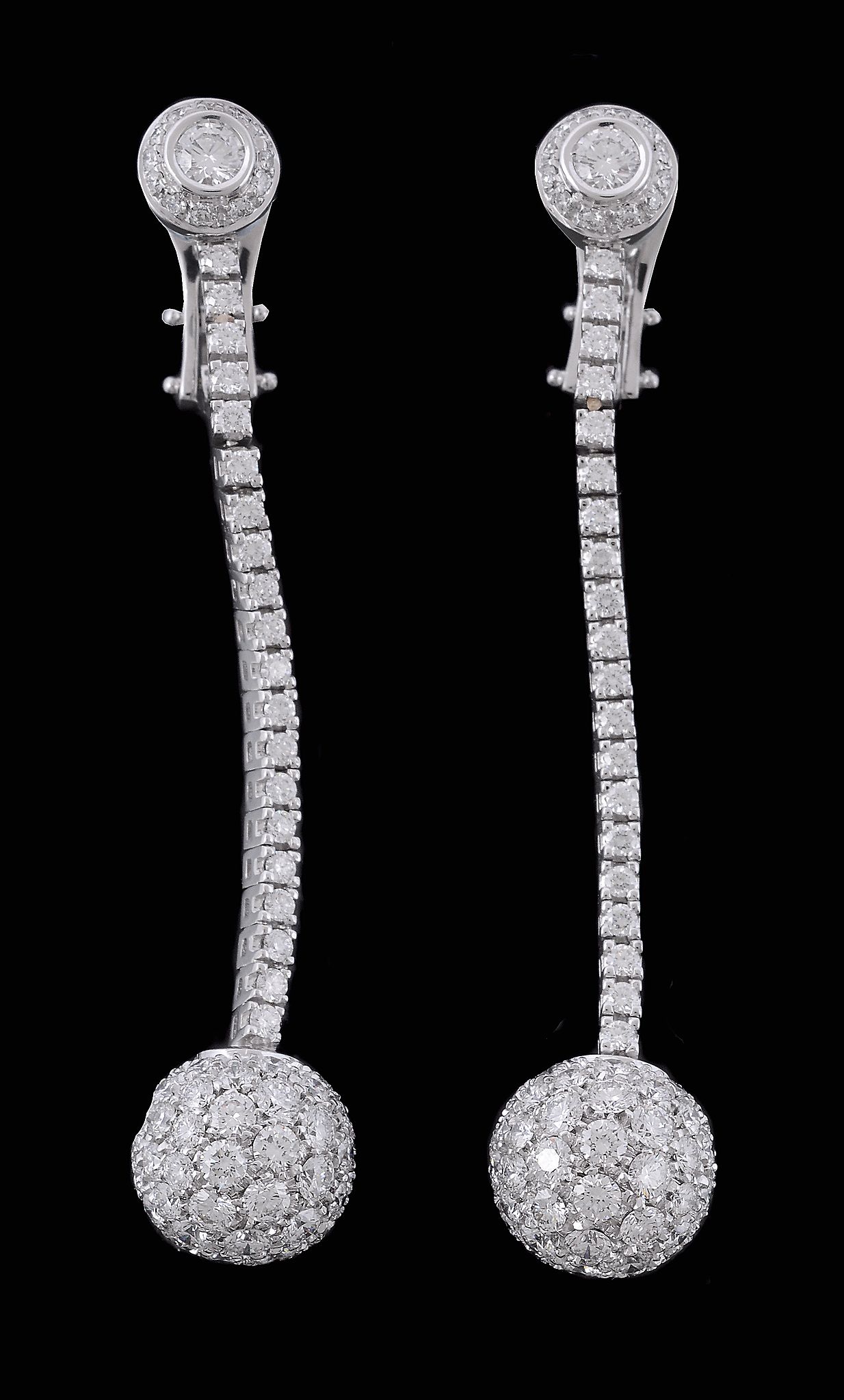 A pair of diamond ear pendents, the spherical drops set with brilliant cut... A pair of diamond