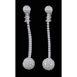 A pair of diamond ear pendents, the spherical drops set with brilliant cut... A pair of diamond