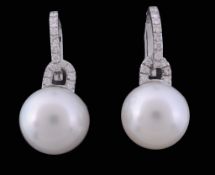 A pair of South Sea cultured pearls and diamond earrings, the 14 A pair of South Sea cultured pearls