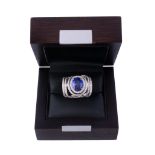 A tanzanite and diamond dress ring , the oval cut tanzanite A tanzanite and diamond dress ring , the
