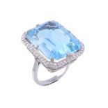 An aquamarine and diamond dress ring , the rectangular mixed cut aquamarine... An aquamarine and