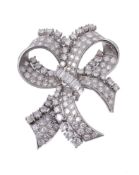 A diamond bow brooch, designed as a ribbon bow and set throughout with... A diamond bow brooch,