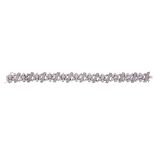 A diamond bracelet, composed of flower head clusters set with brilliant cut... A diamond bracelet,