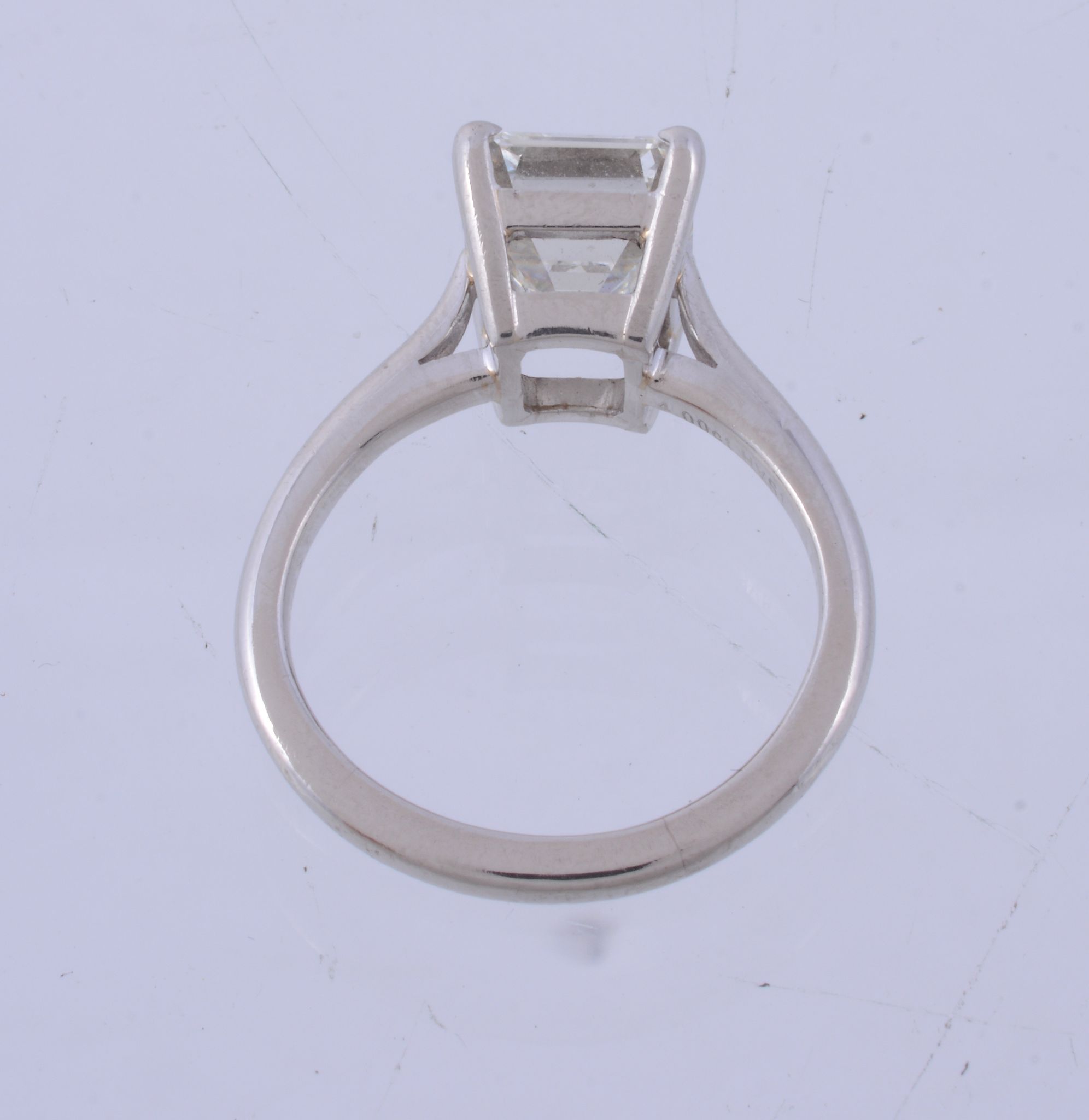 A diamond single stone ring , the step cut diamond weighing 4 A diamond single stone ring , the step - Image 3 of 4