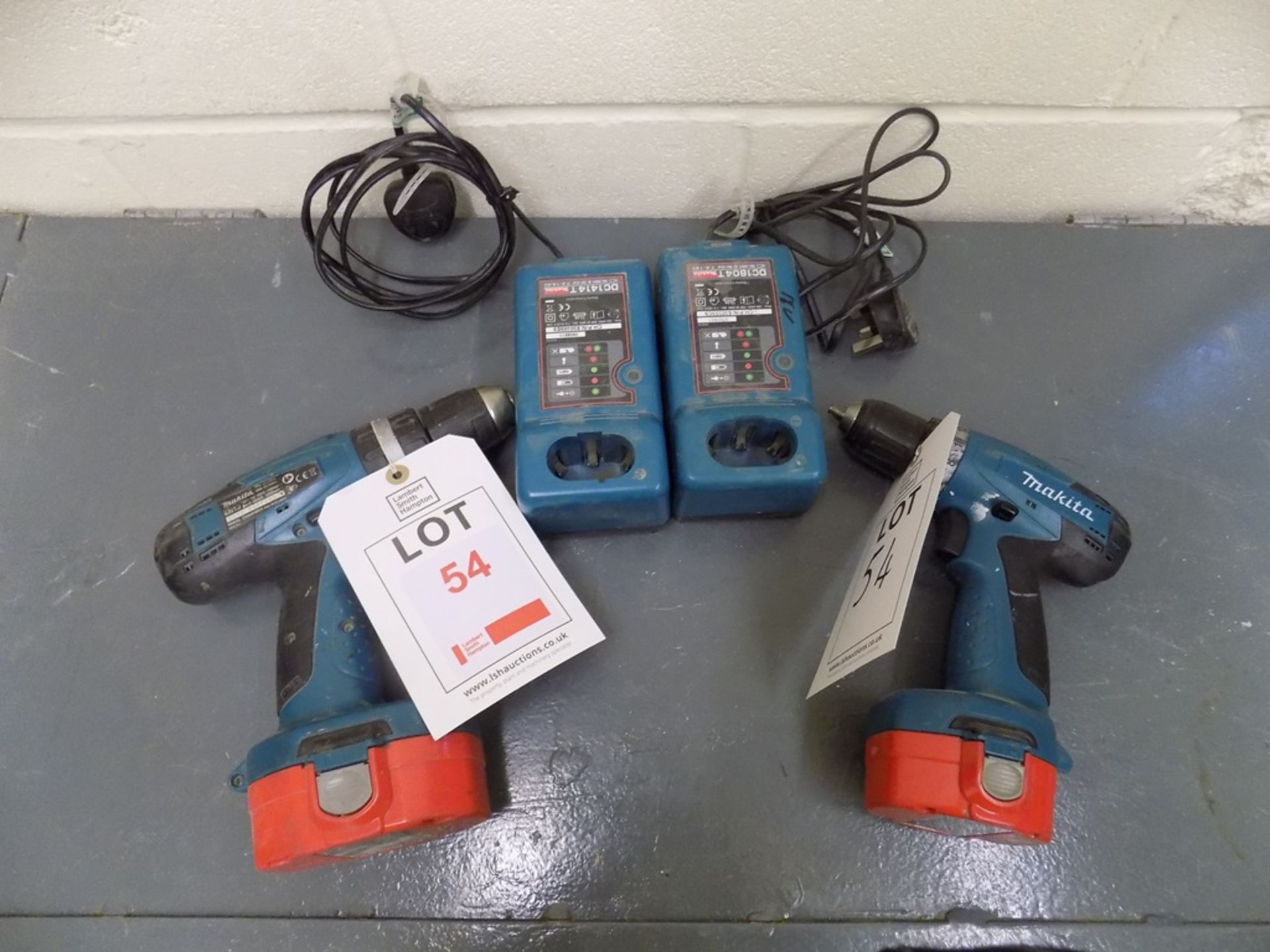 2 Makita cordless drills, each with charger