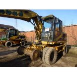 Caterpillar M312 road rail wheeled excavator (2002), indicated hours 6138.8, PIN no.