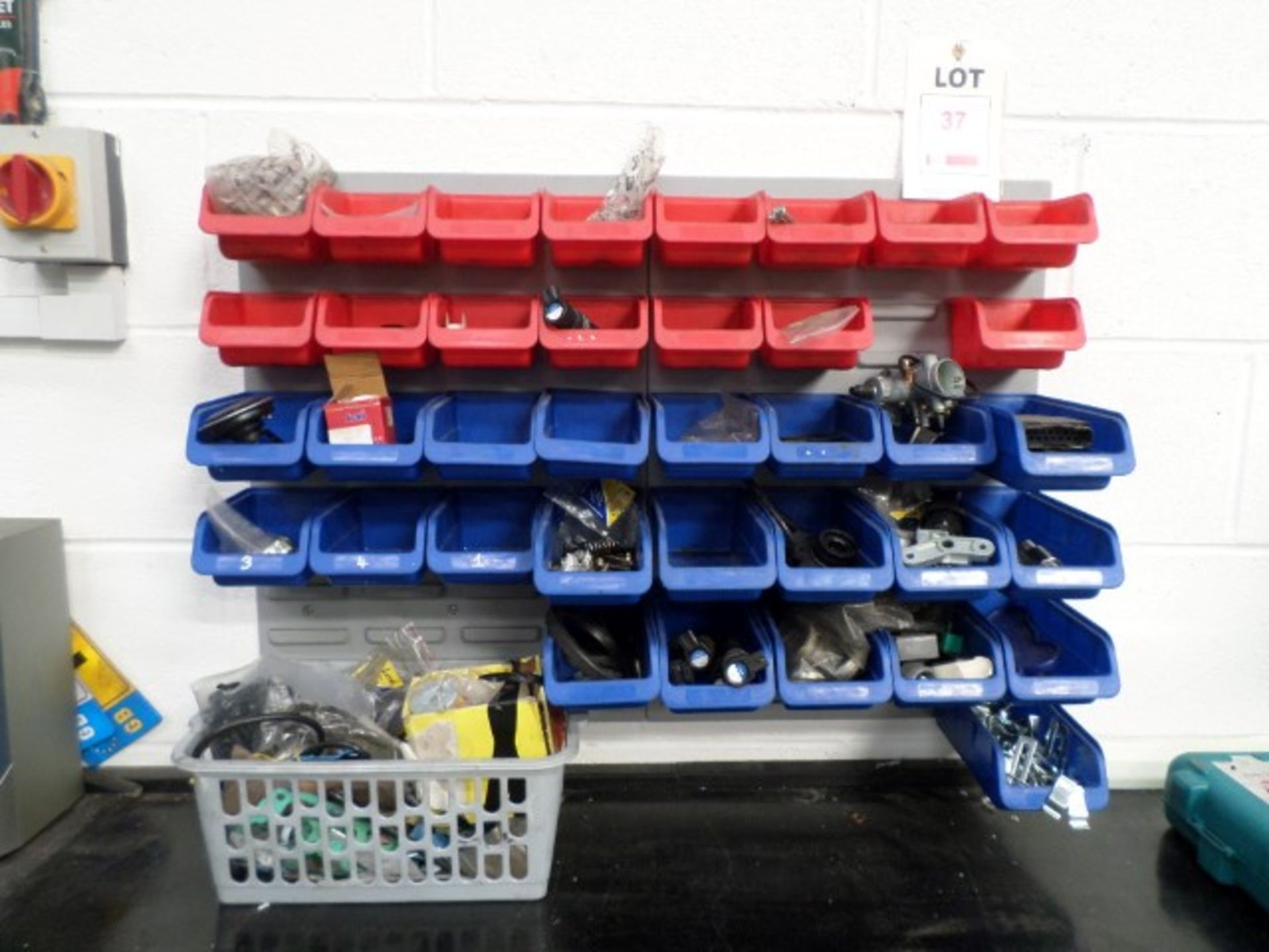 2 wall boards with 38 plastic storage bins and contents