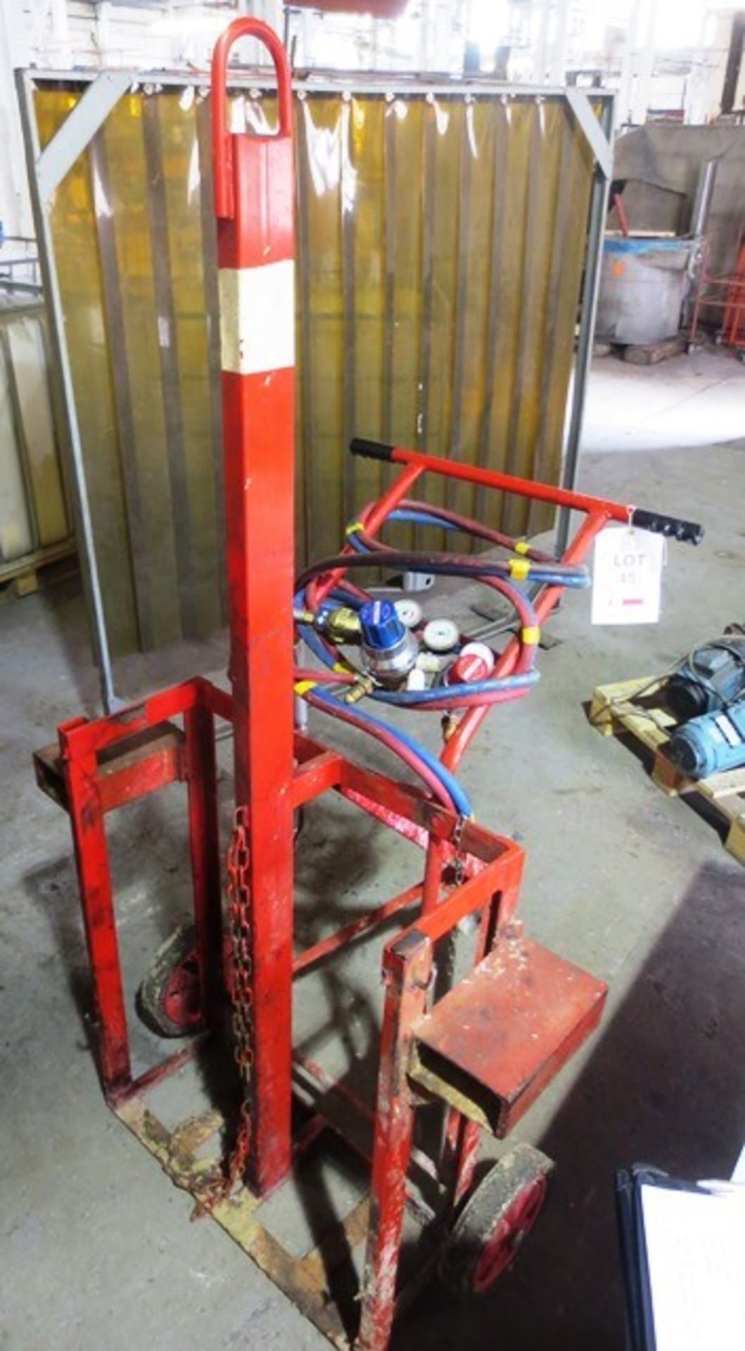 Un-named twin bottle welders transport trolley with regulator and welding torch