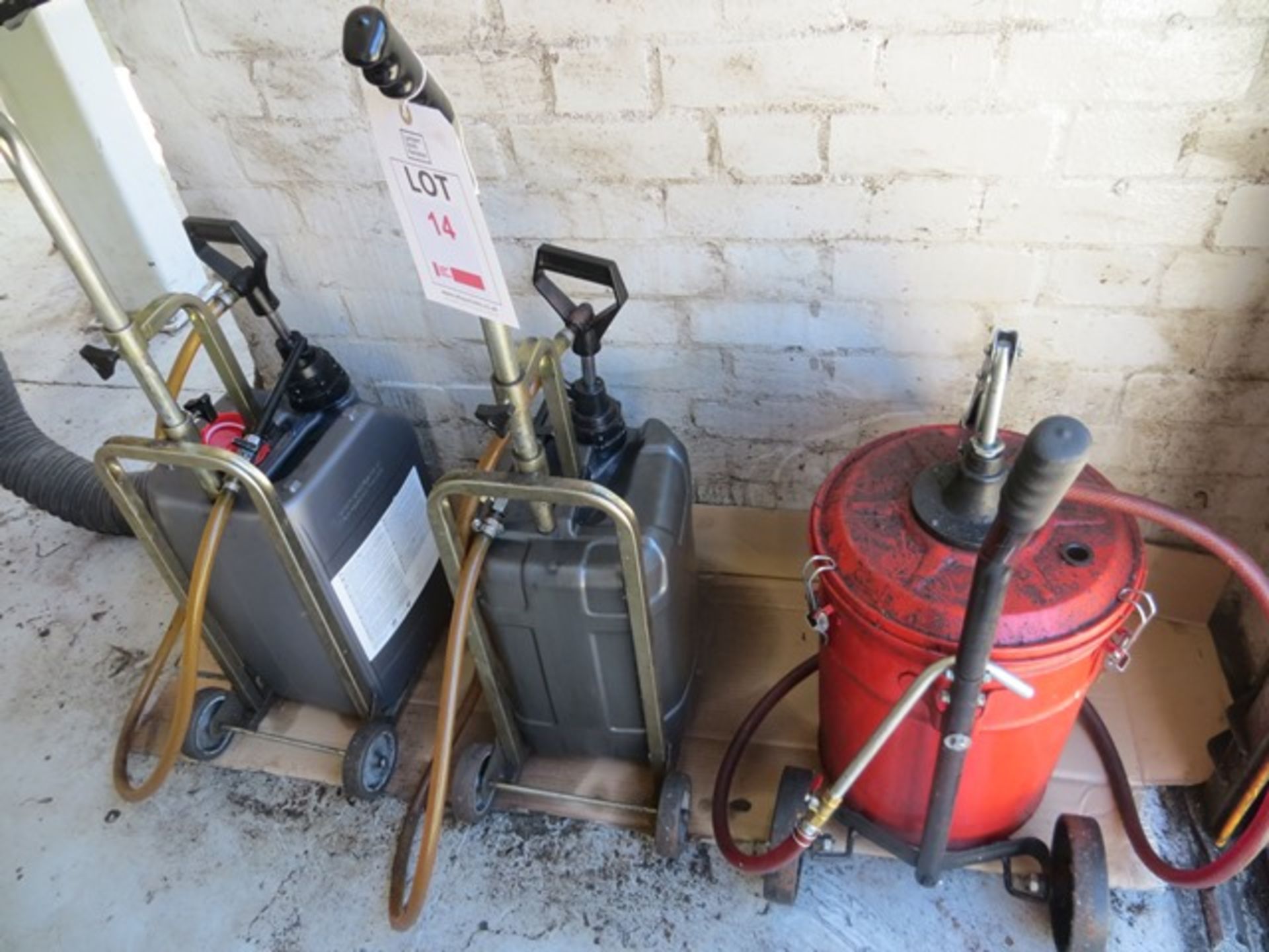 Three hand operated oil pumps