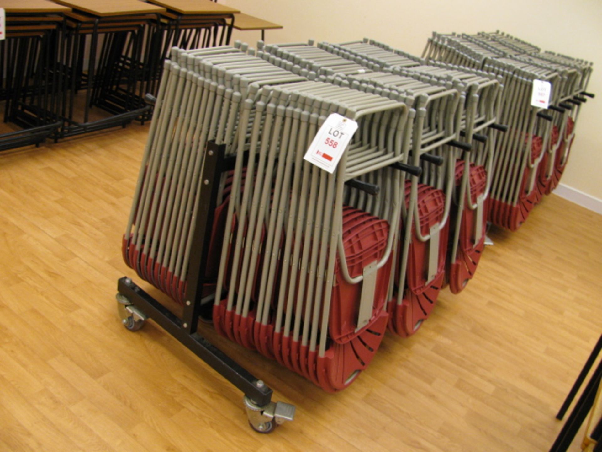 Seventy two folding plastic chairs on mobile rack