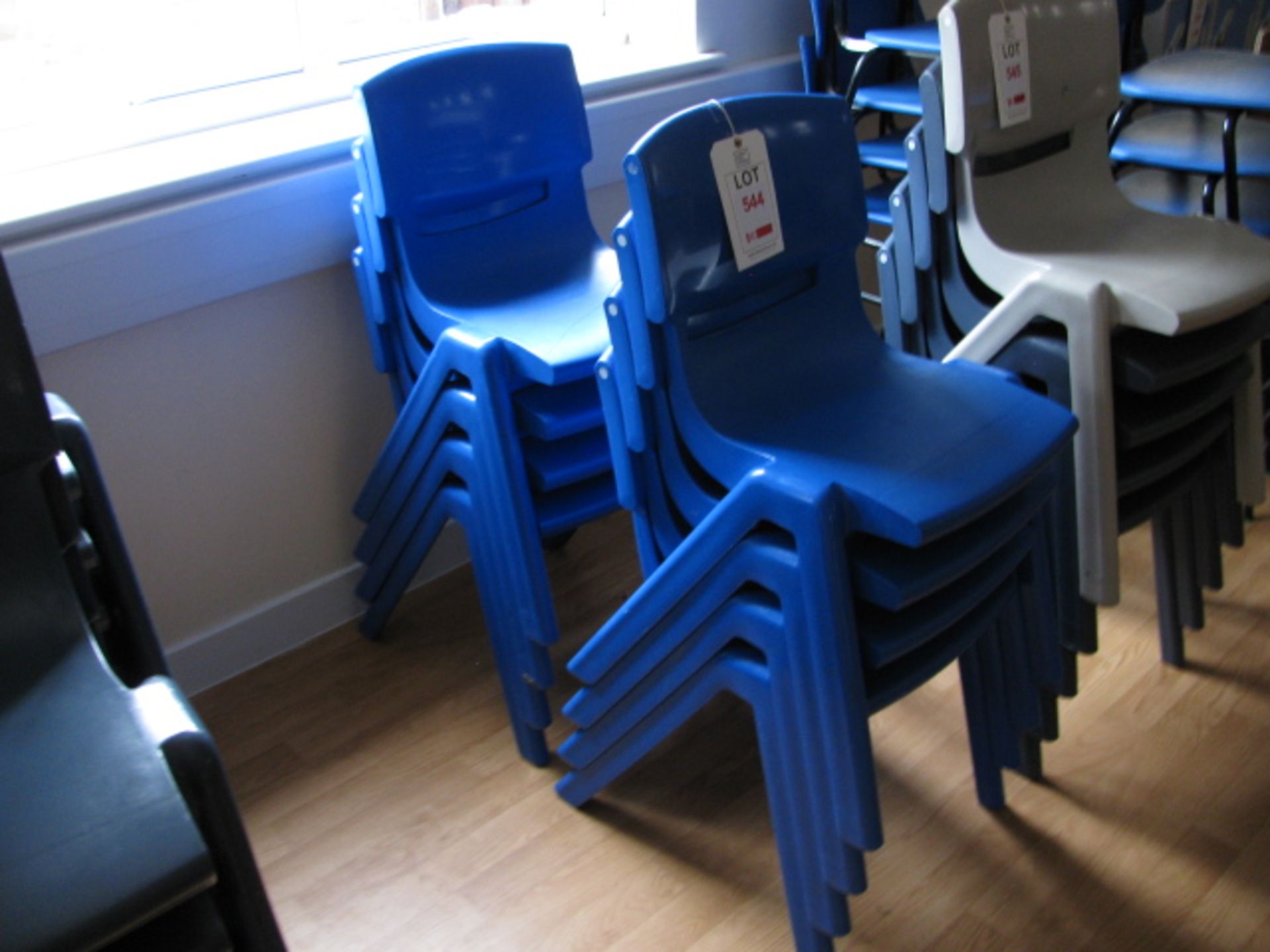 Eight Sebel Postura light blue plastic chairs