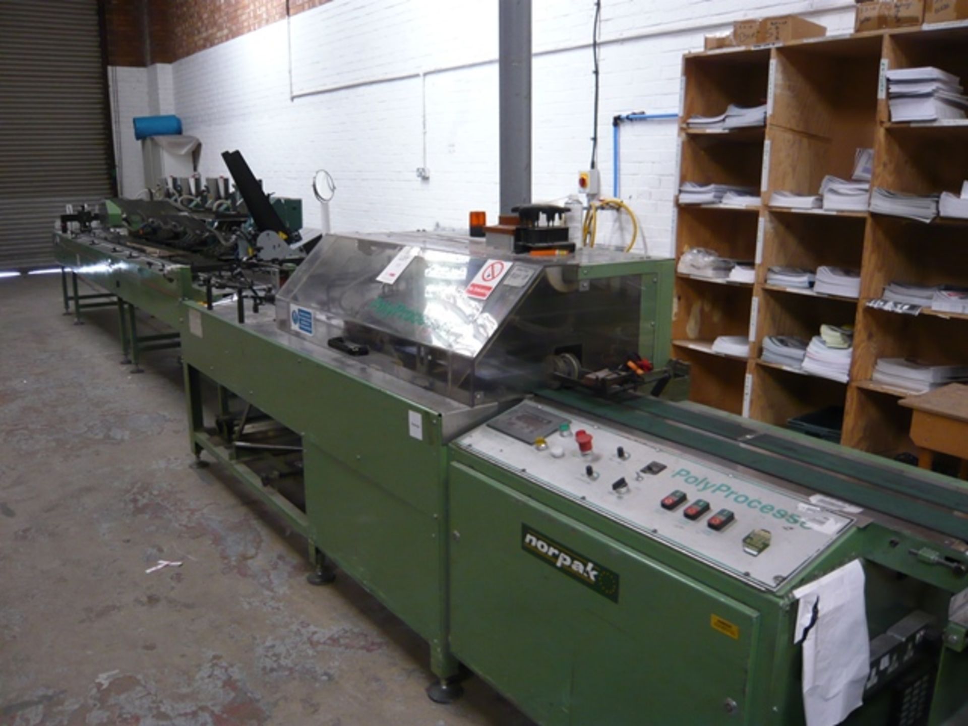 Norpak Polyprocessor mailing line with: 4 insert feeders, Envelope hopper feeder, Film unwind,