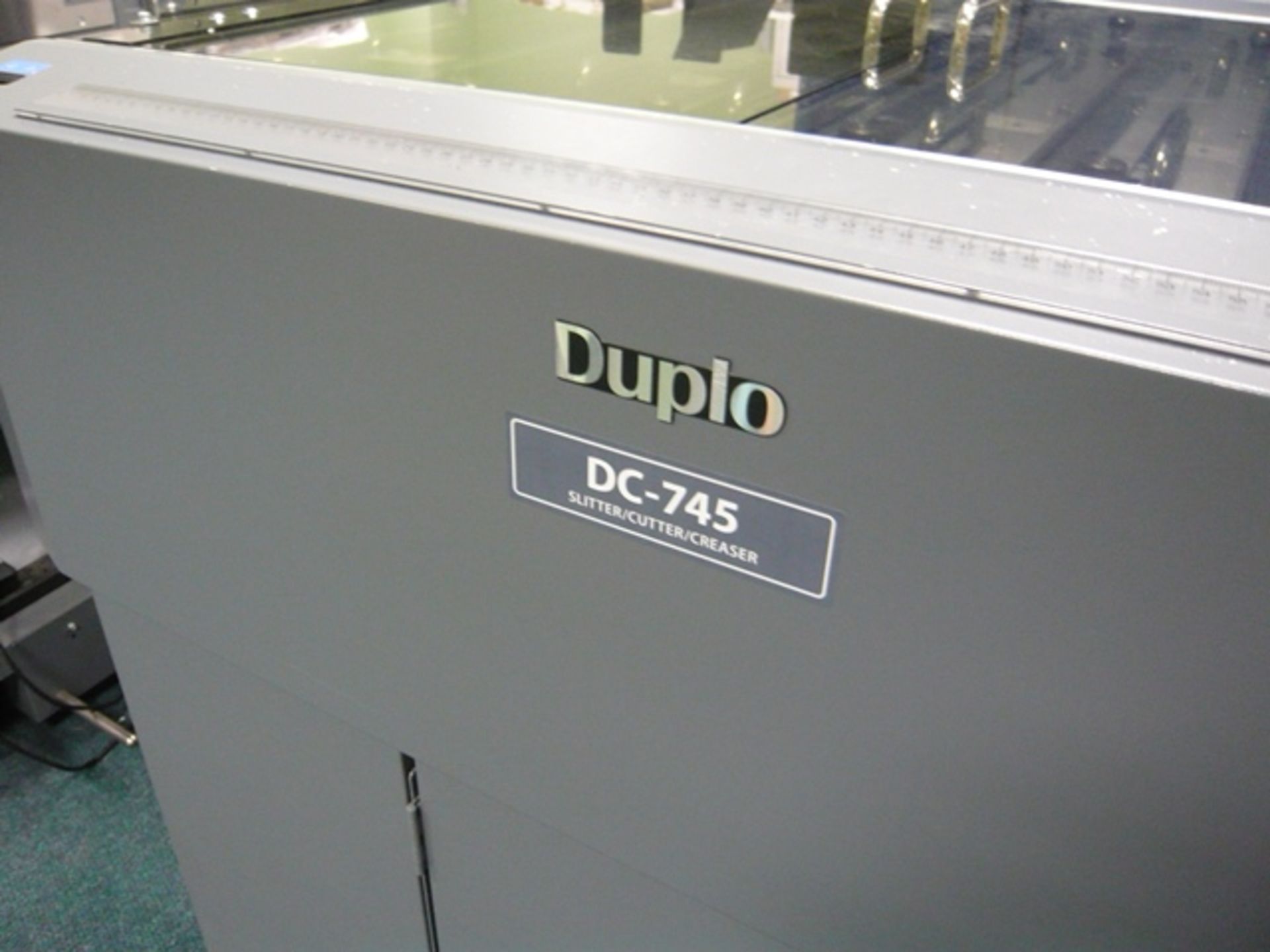 Duplo finishing line comprising: Pile feeder, DC745 slitter creaser cutter, DC-F2 folder, Belt - Image 2 of 9