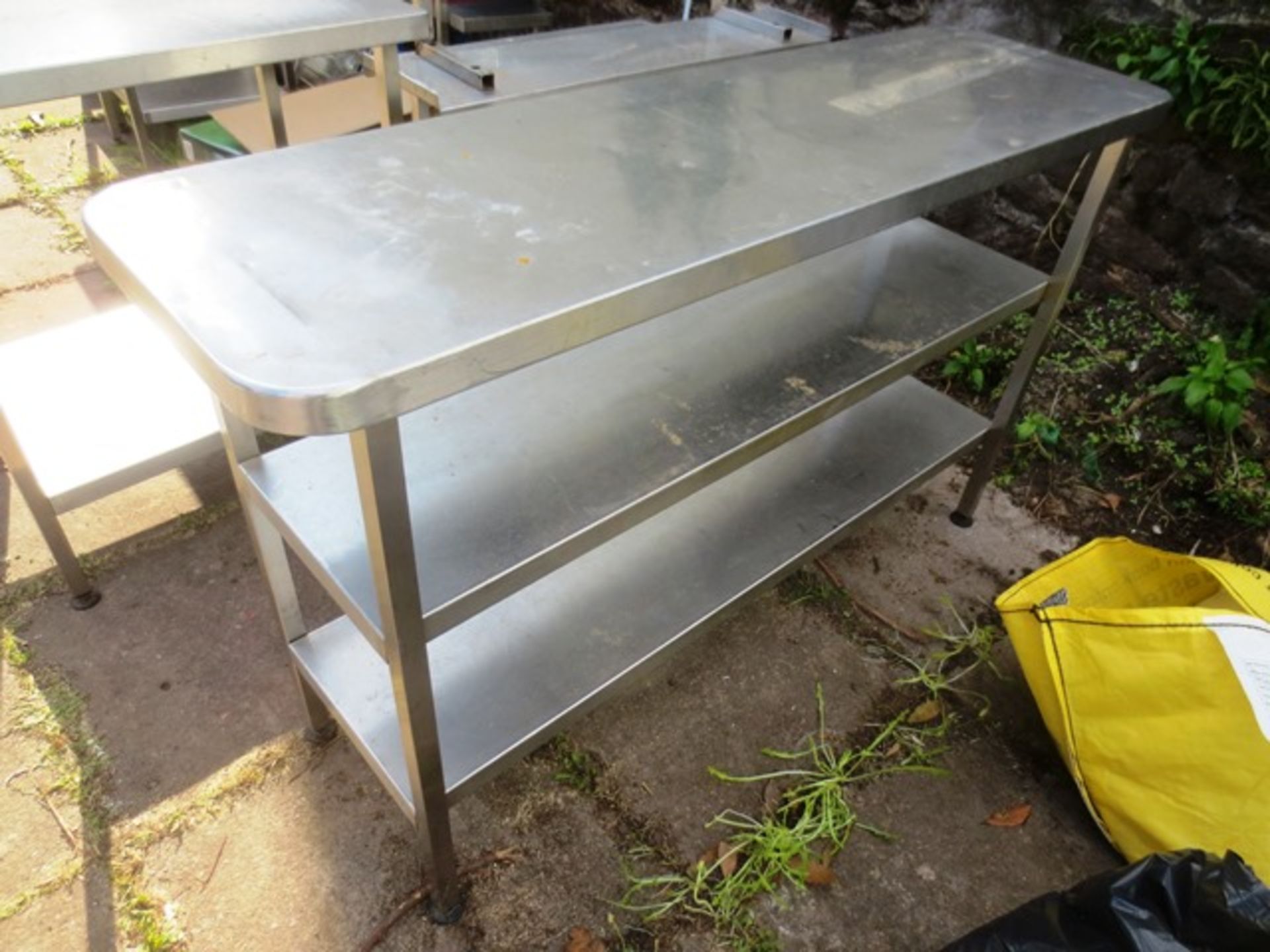 Stainless Steel table with twin under counter shelves, approximate dimensions: 1500 x 450mm Please