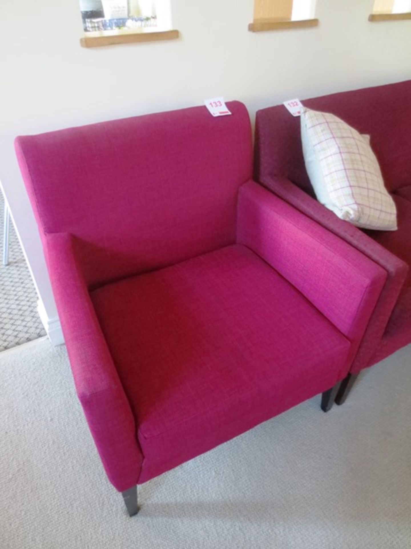 Purple/pink cloth upholstered armchair, with dark wood effect legs, approx dimensions: 700mm