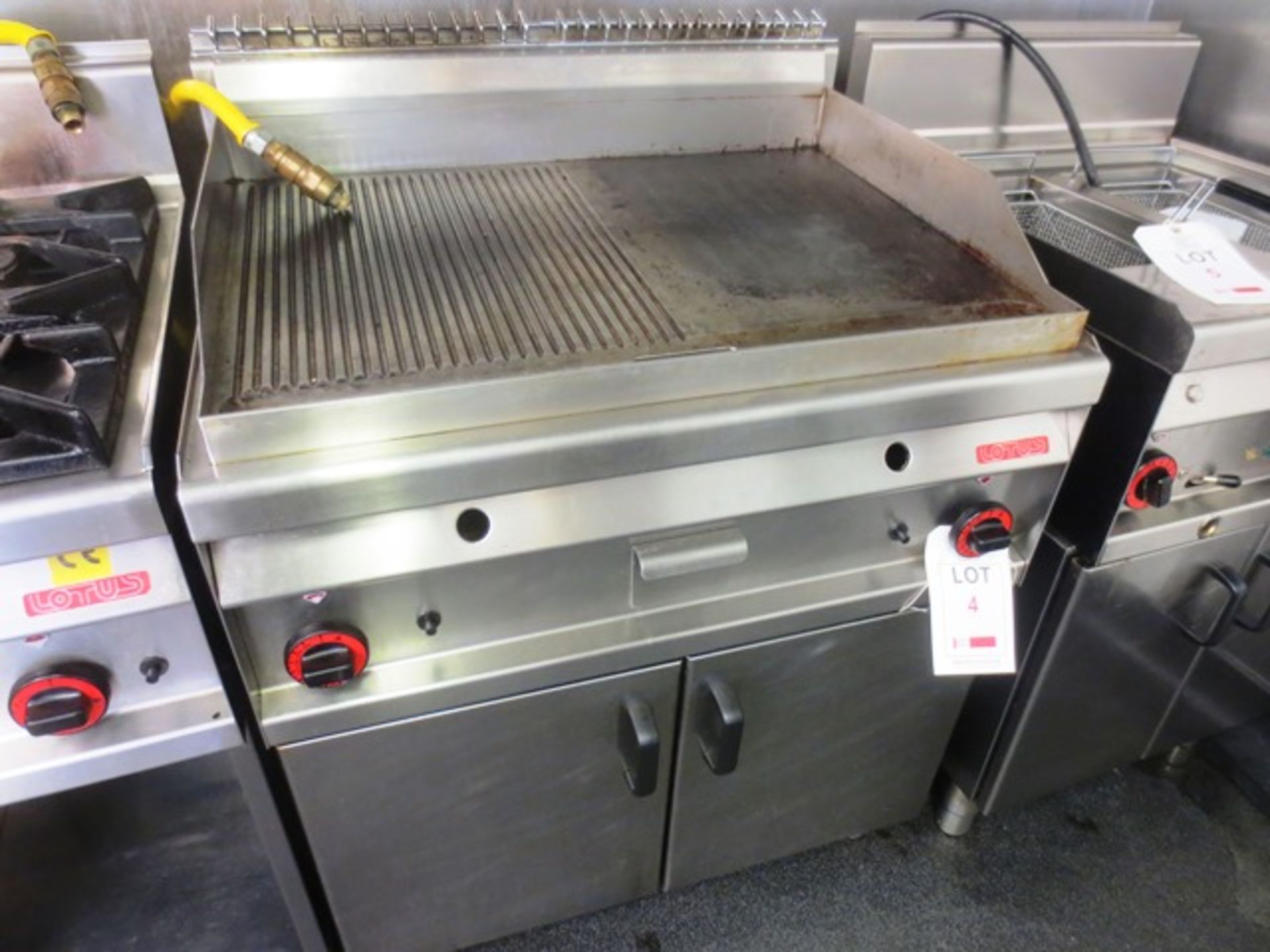 Lotus F R-8G, stainless steel gas fired hot plate with twin door warming cupboard, serial no: