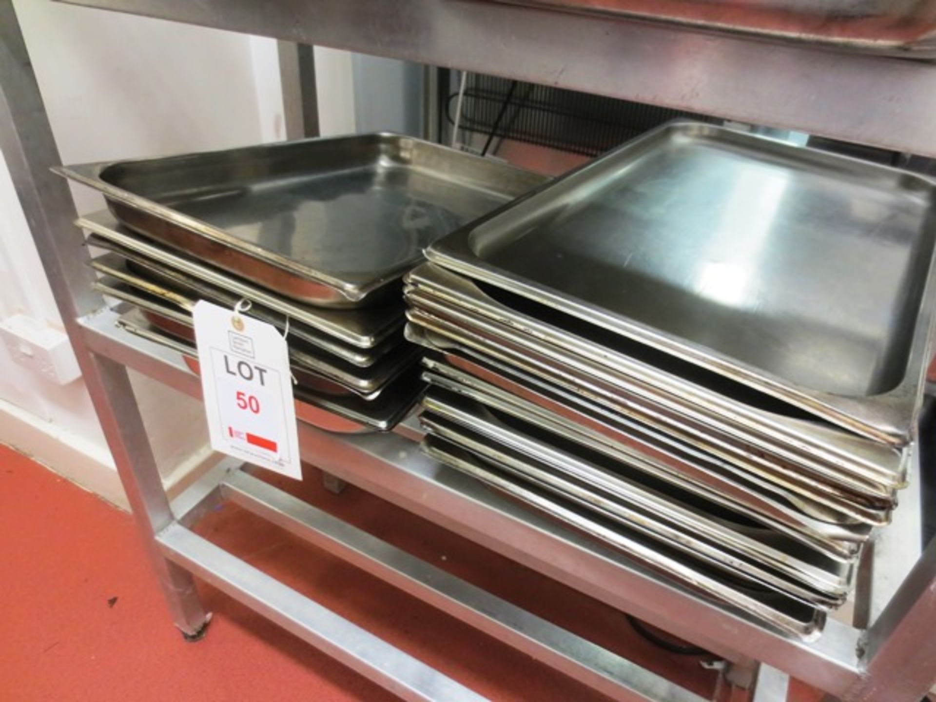 Quantity of stainless steel serving trays (approx 15 in total)