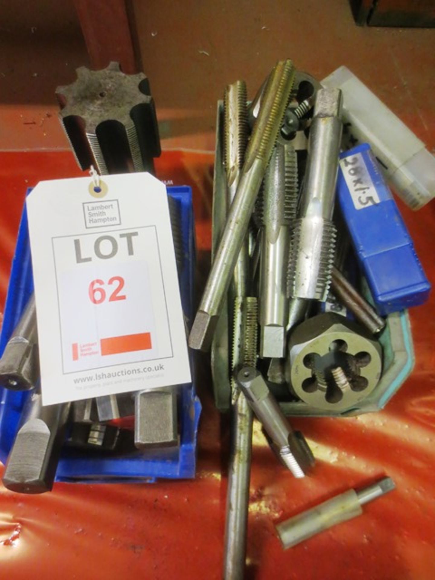 A box of HSS hand taps and dies, assorted sizes ranging from 30mm (Please note: Steel tote bins