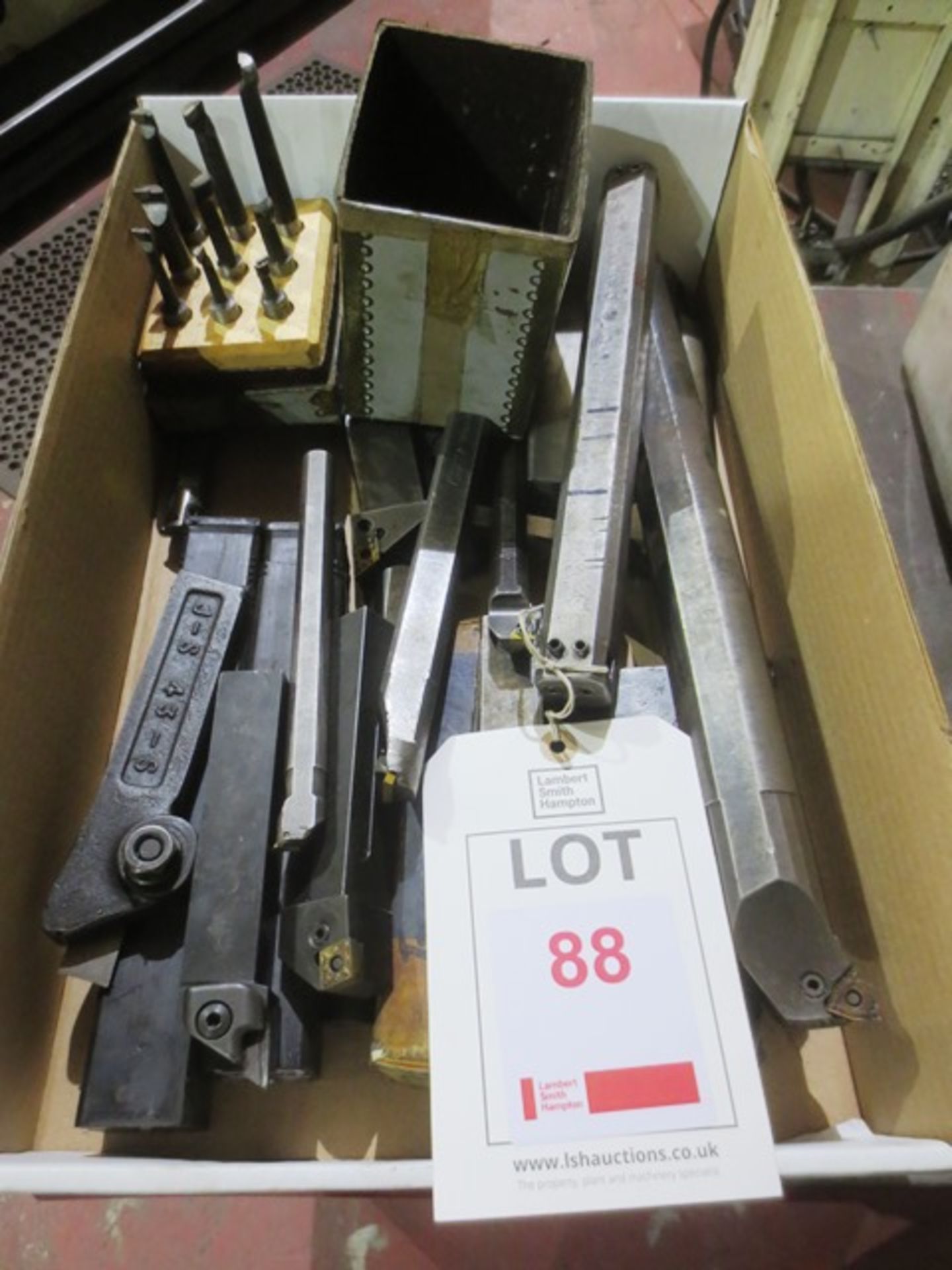 Box of assorted insert tip lathe boring and turning tools.