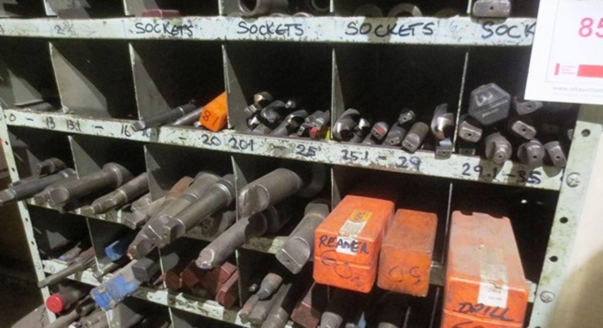 Contents of three shelves including various slot drills (0 - 50mm)