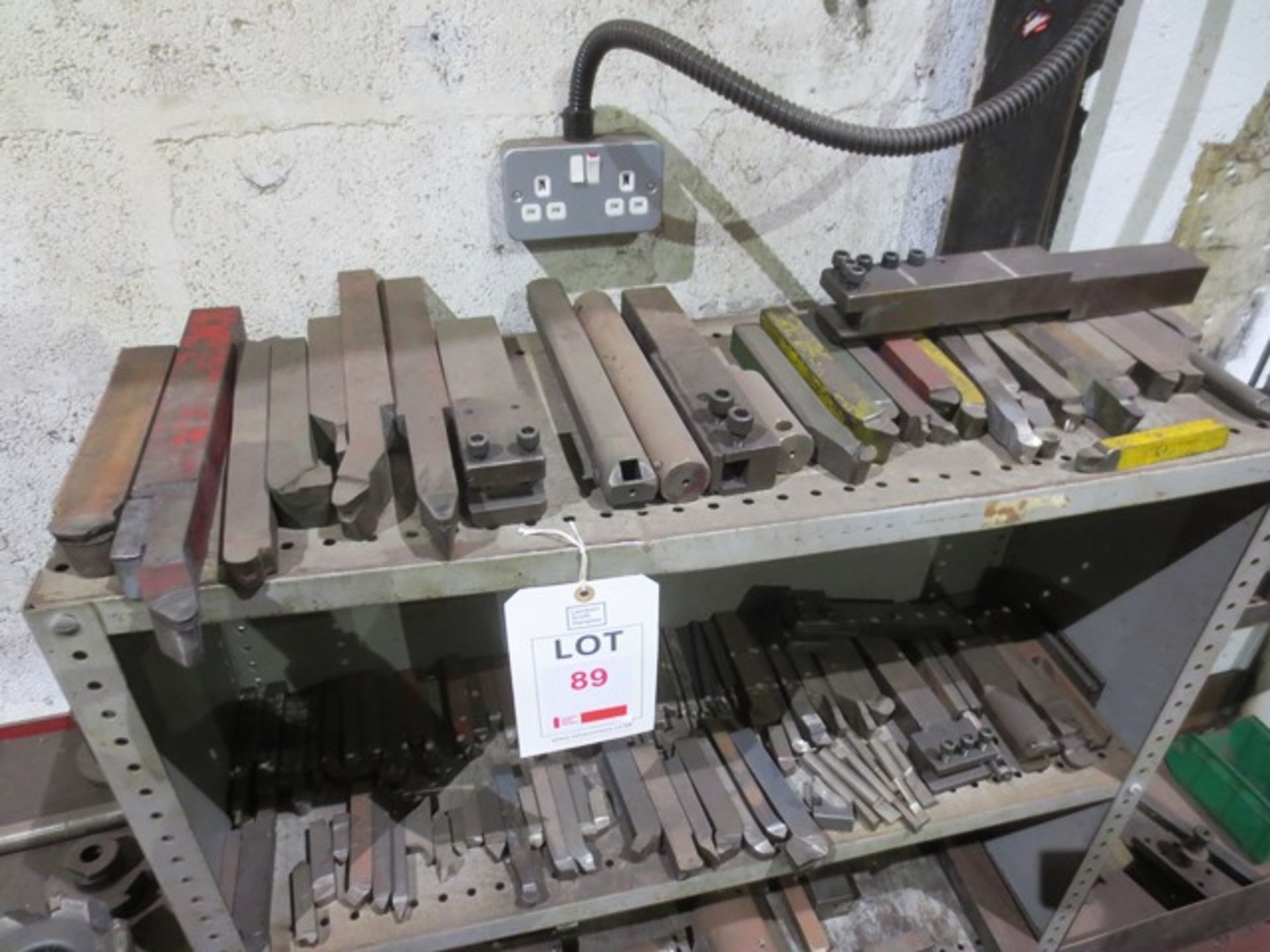 Contents of two shelves including approx 60 various tungsten tip lathe turning tools and holders