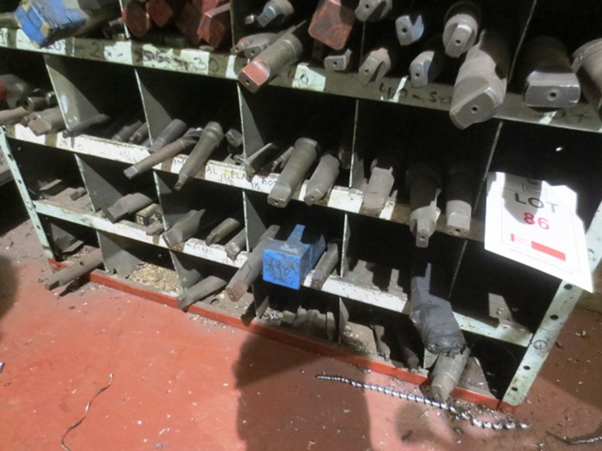 Contents of three shelves including various imperial/metric flat-bottomed drills