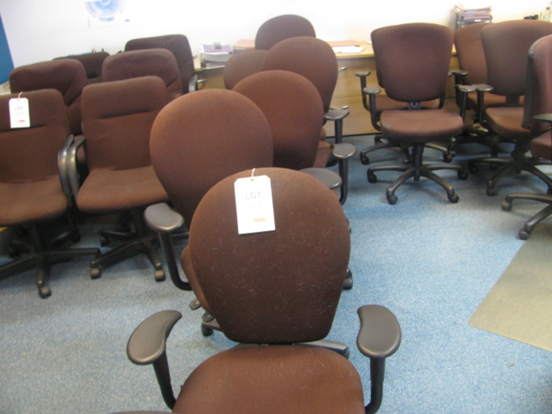 6 Brown fabric upholstered gas operated rev chairs