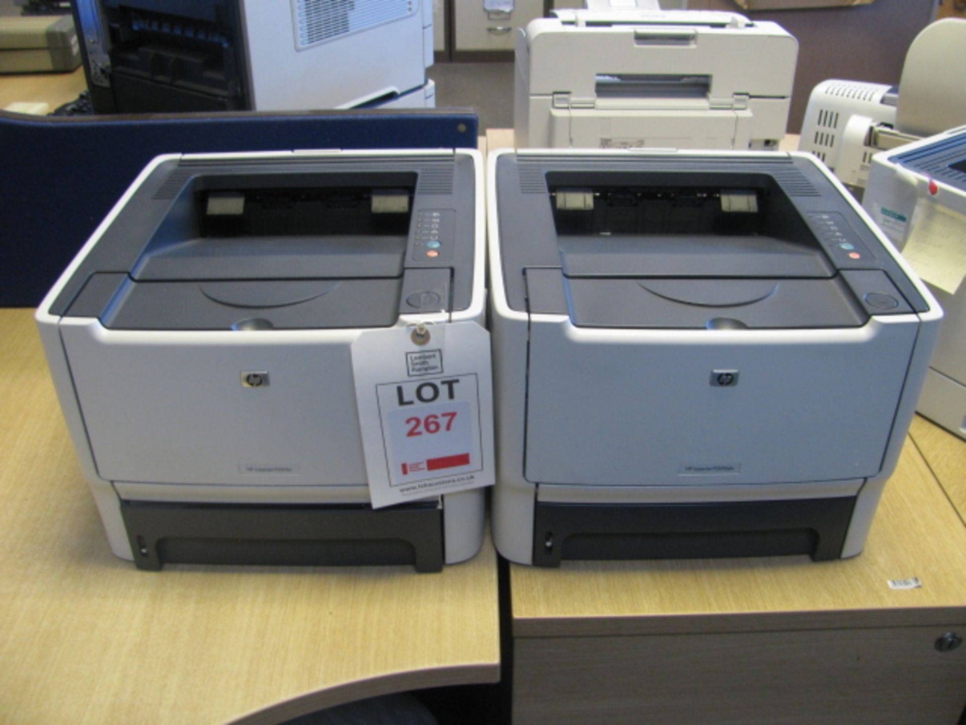 Two Hewlett Packard Laserjet P2015dn printers