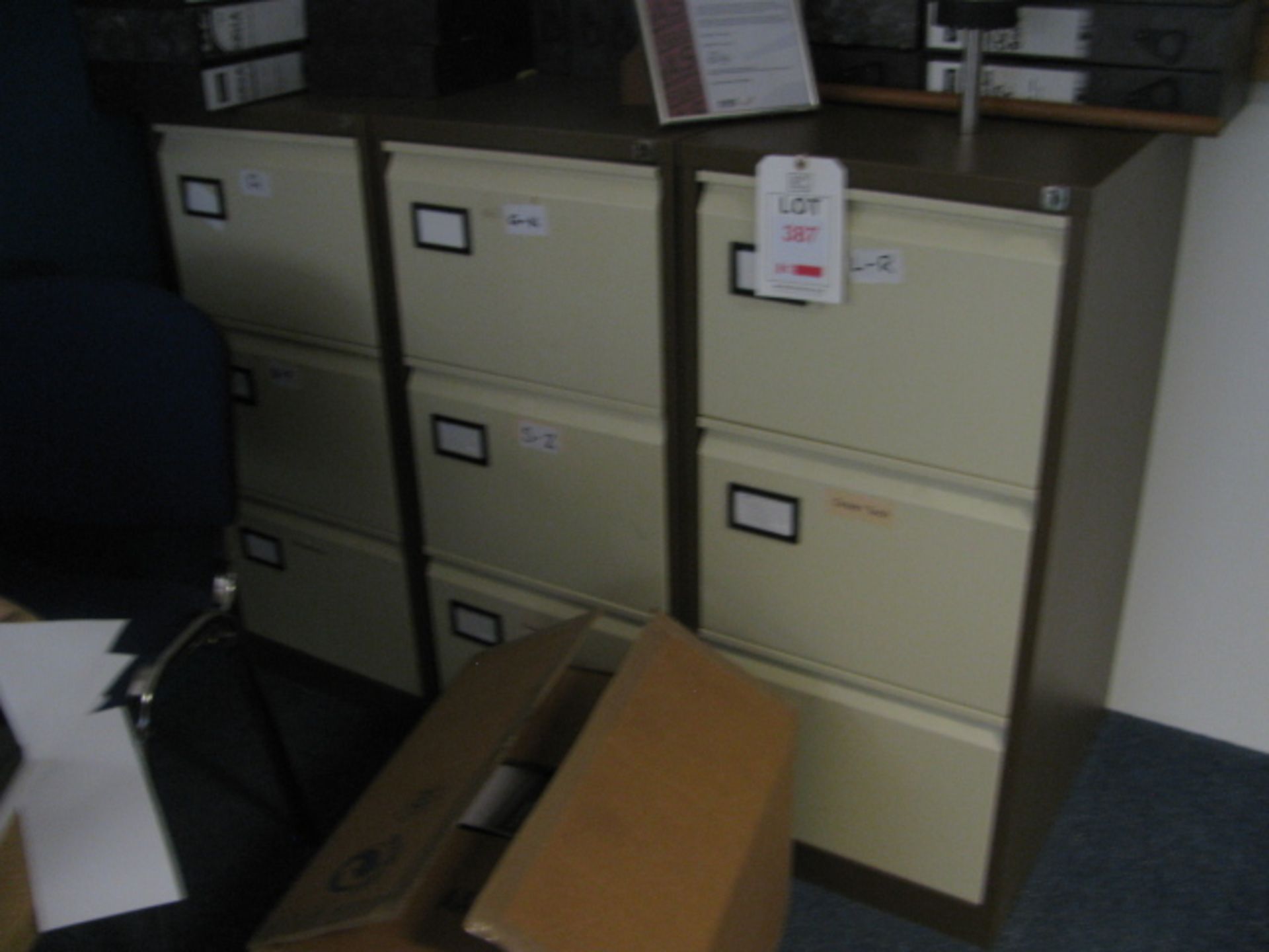 Steel low stationery cupboard and 3 x steel 3-drawer filing cabinet