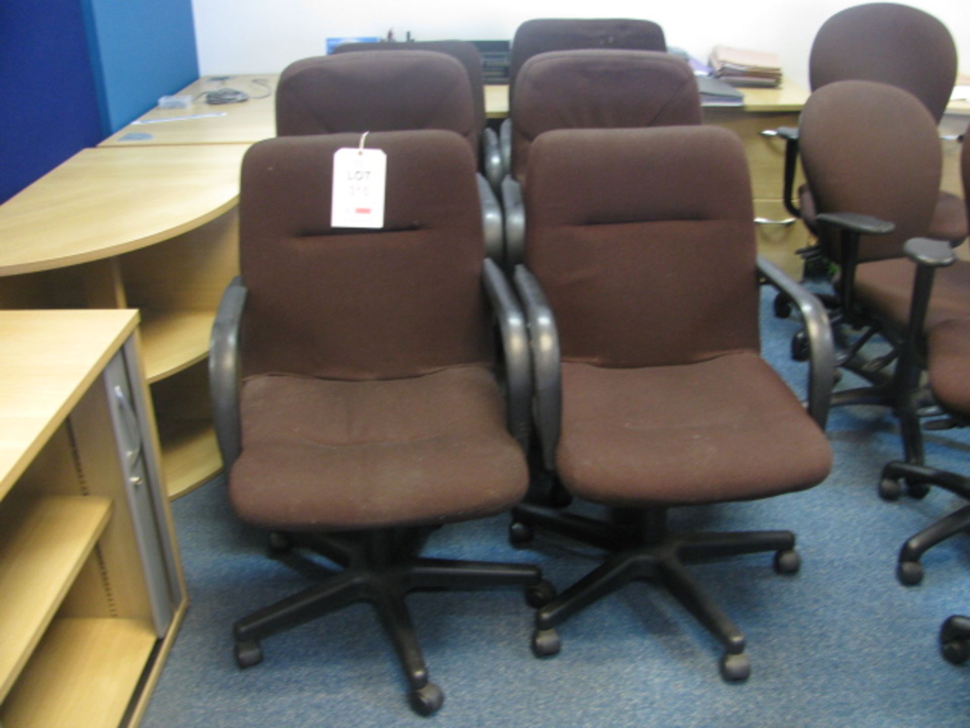 6 Brown fabric upholstered gas operated rev chairs