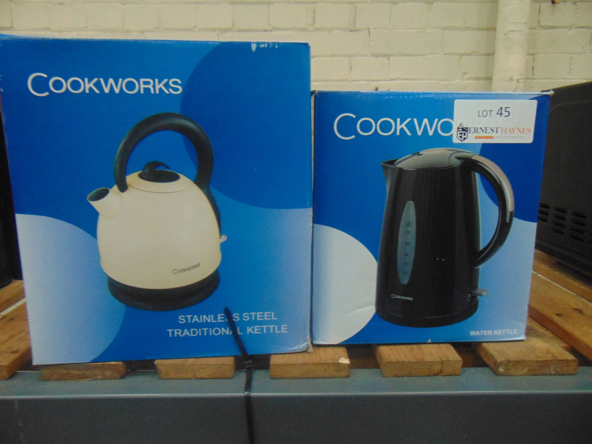 one black cookworks kettle and one traditional cookwork kettle