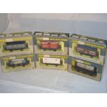 OO Gauge: A group of boxed Wrenn wagons to include a Fisons Fertiliser wagon. VG in G boxes (6)