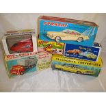 A selection of vintage boxed friction powered vehicles by various manufacturers (mostly Hong Kong)