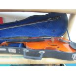 Cased violin with sheet music