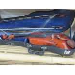 Cased violin with sheet music