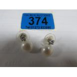 Pair of Platinum pearl and diamond earrings