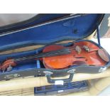 Cased violin with sheet music