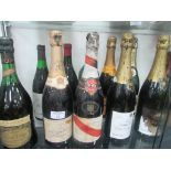 10 full unopened bottles of Vintage wine and Champagne and 1 empty bottle