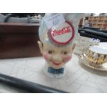 Coca Cola head cast iron money box