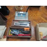 Box of pens and desk stand