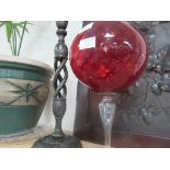 Antique candlestick and red glass