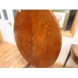 Inlaid oval tilt top table