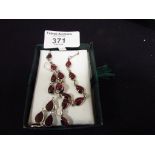 Red stone white metal necklace and earrings