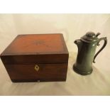 A wooden inlaid box and a pewter jug.