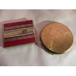 A vintage Stratton compact (mirror a/f), and a push out compact depicting the Ypres Menin Gate.