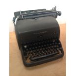 A vintage Remington typewriter. PLEASE NOTE THAT THIS ITEM IS EXCLUDED FROM OUR P&P SERVICE. BUYER