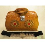 An African style leather handbag and a ladies belt.