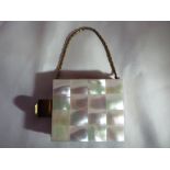 A vintage Mother of pearl compact, lipstick holder and card case.