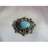 A Victorian WM mourning brooch with turquoise cabochon.